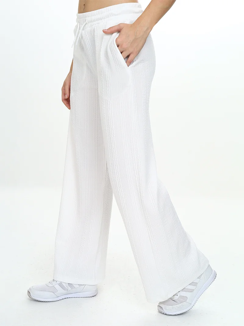 دينوكيدس بنطلون رياضي أساسي واسع الساق للبنات بلون إكرو